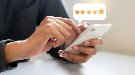 Person reviewing on cellphone Reviews-540 Person reviewing on cellphone