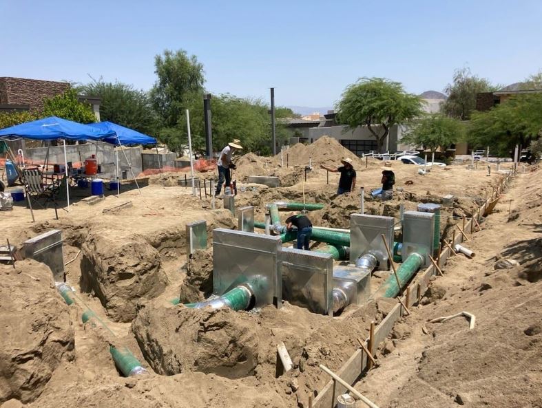 Workers doing underground HVAC